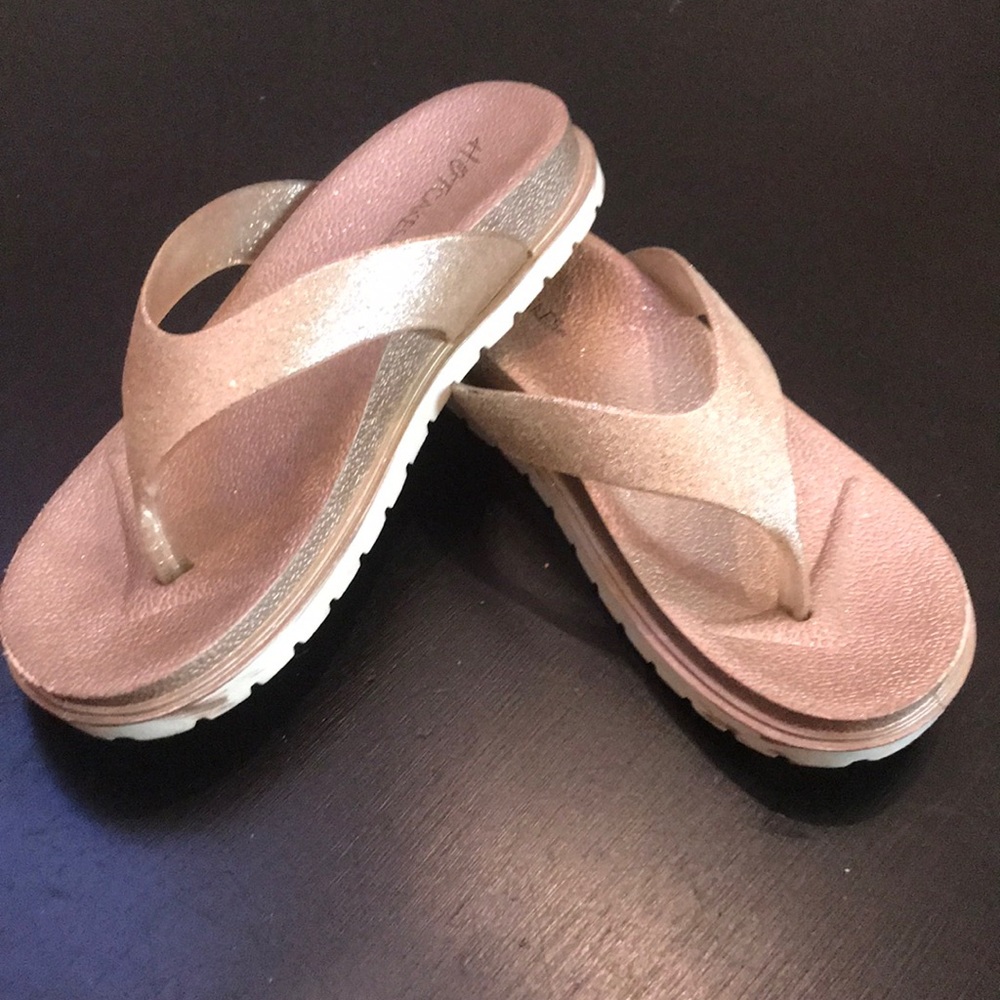 Rose gold flip flops